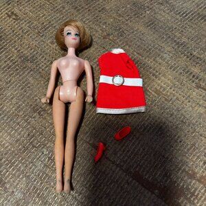 Topper Dawn Jessica doll wearing orange Stewardess uniform